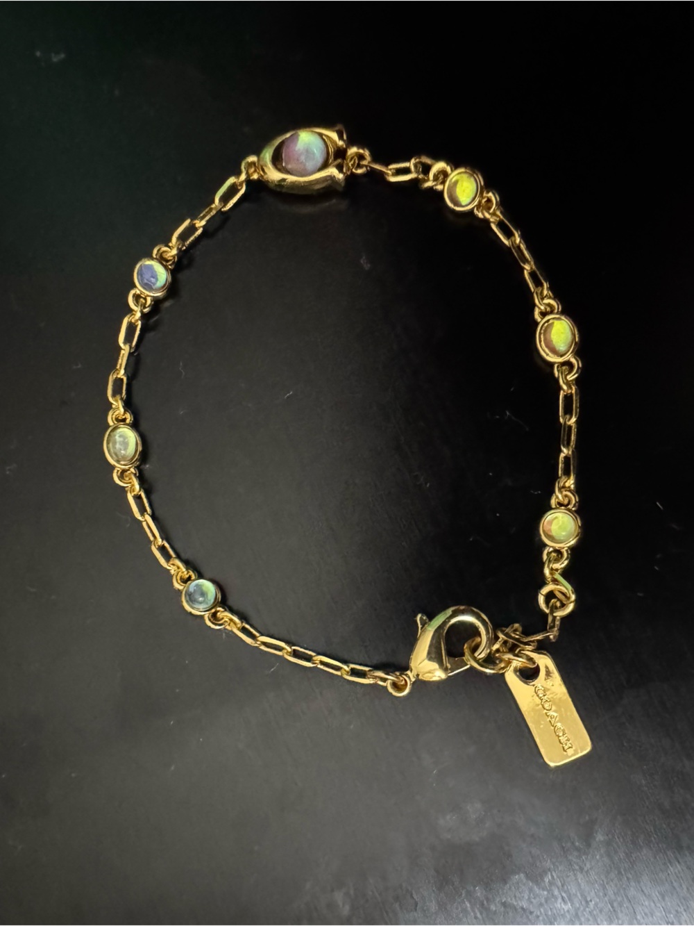 Coach Gold-Tone Bracelet with Sculpted C and Opalescent accent